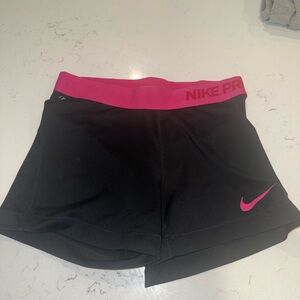 Nike Women's Black Athletic Shorts with Pink Waistband and Swoosh